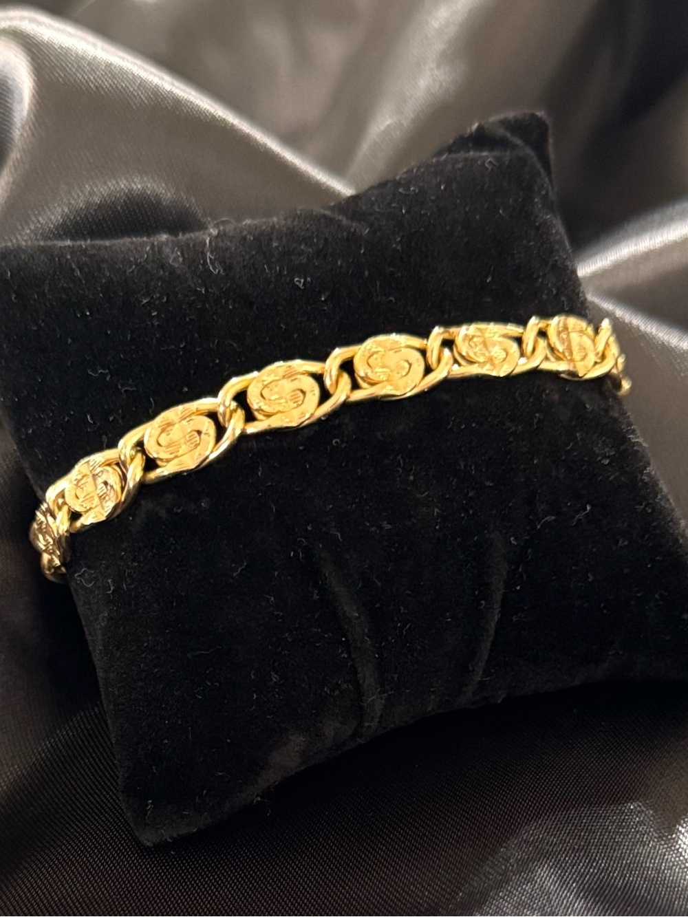 Gold-Tone Bracelet Feat. Pattern of Oval Links Flattened into a Twisted Design